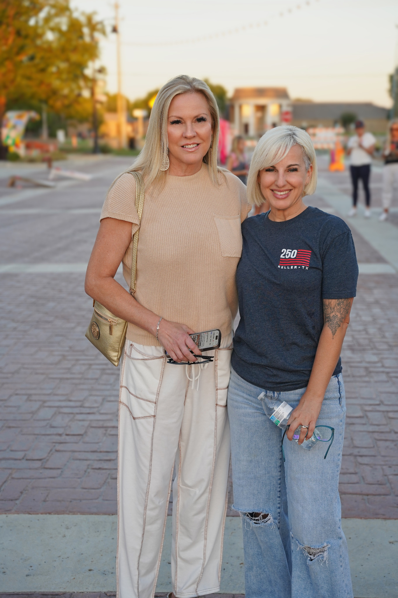Keller Texas Living and Kickin’ It In Keller smile together for a photo on Bates Street at National Night Out.