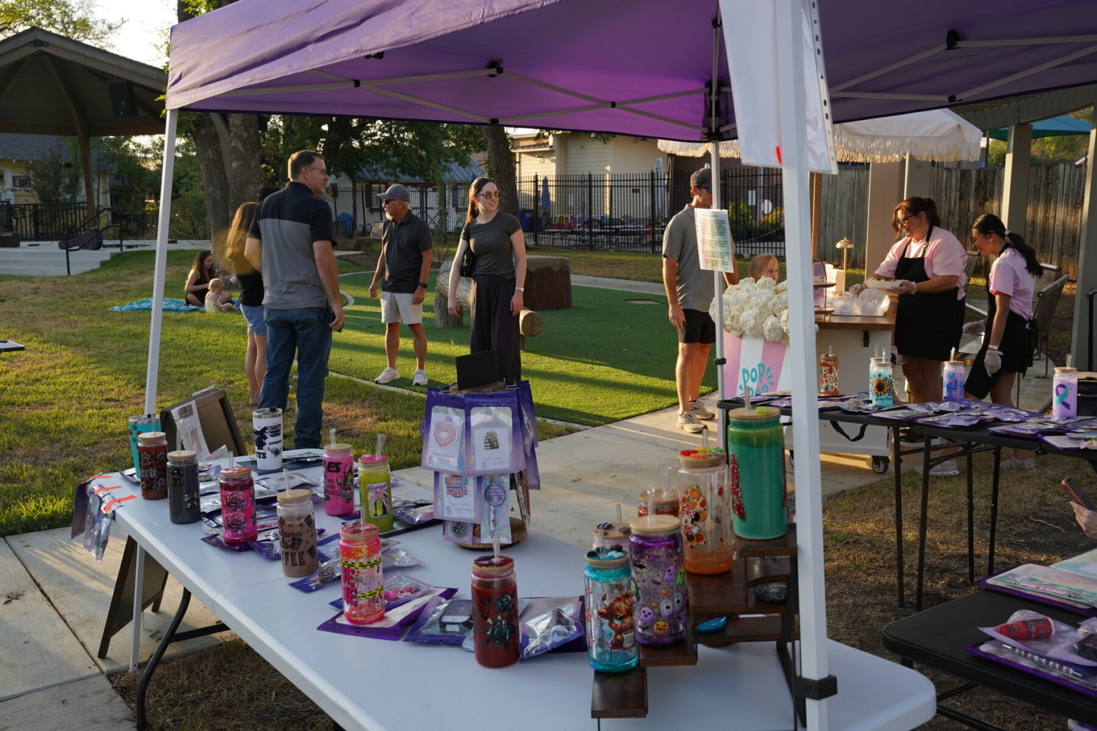 A vendor display and visitors at Depot Nights on September 25, 2026.